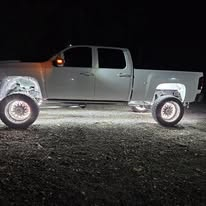 Lifted black pickup truck in the S&P Off-Road shop